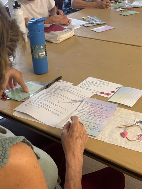 Students studying and writing at a workshop table